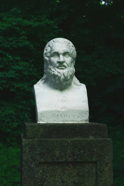 there is a bust of an old man sitting on a pedestal