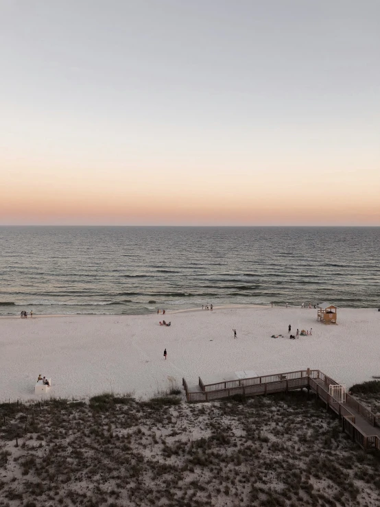 a beach and boardwalk on a clear day