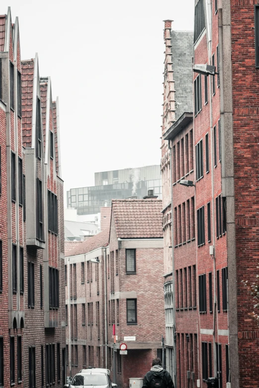 a row of buildings on street next to traffic