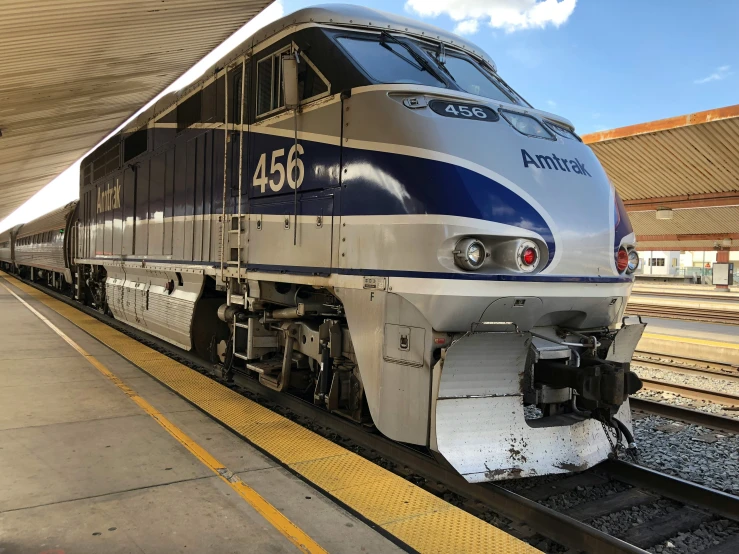 a train parked in the station with its tracks facing away