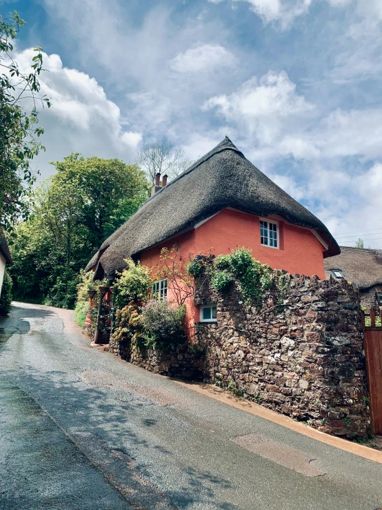 an old brick building on the side of a road