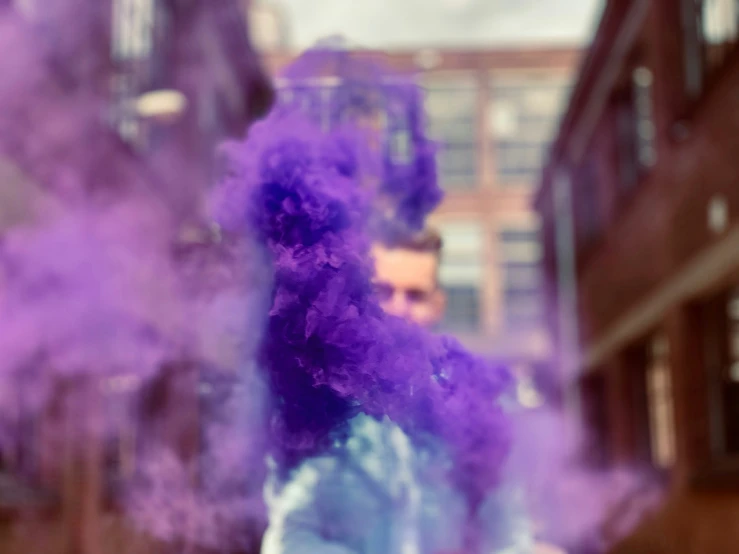 a person covered in a bright purple substance