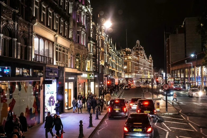 a number of cars on a city street at night