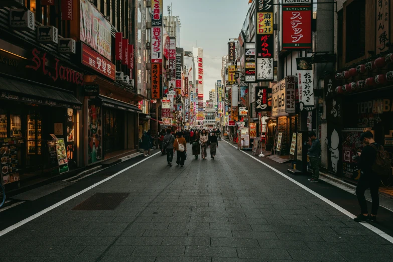 people walk through the streets of a city