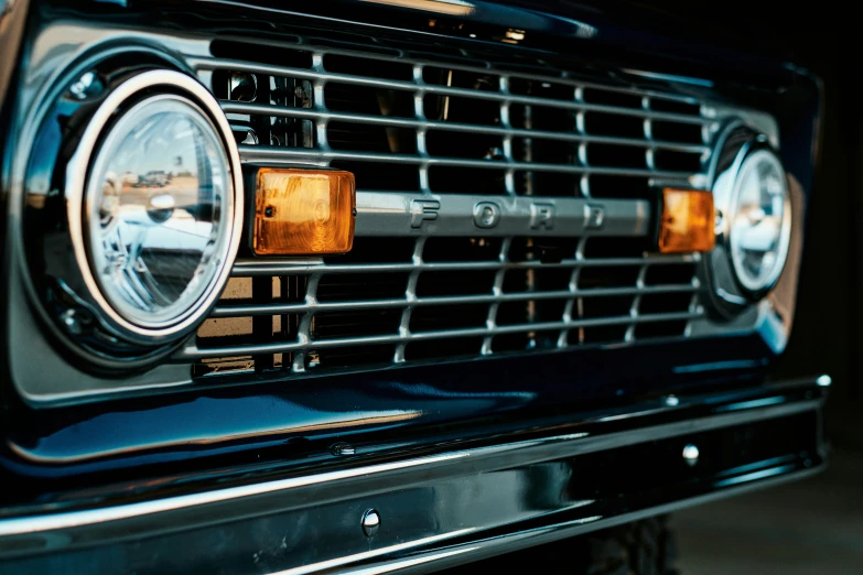 a grille of a car on the side of a road