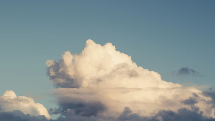 a airplane flying into the air during a cloudy day