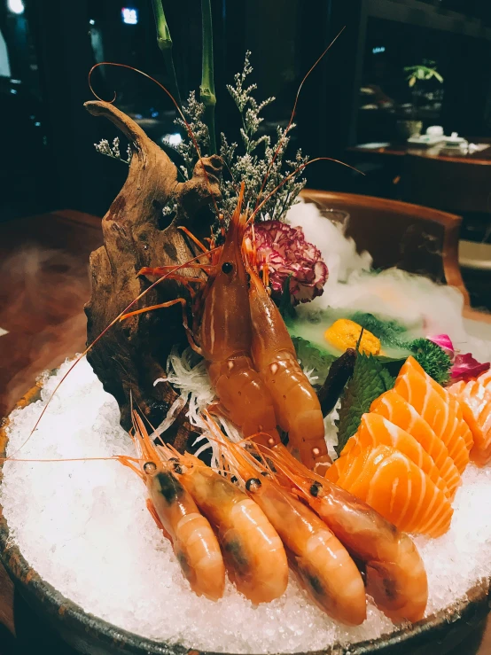 various sushi on an ice covered round platter