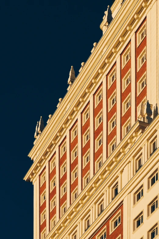 a large building with lots of windows and a clock on the top