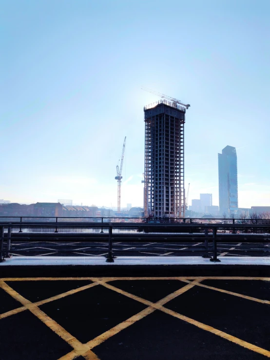 an apartment tower near the city with its windows still missing