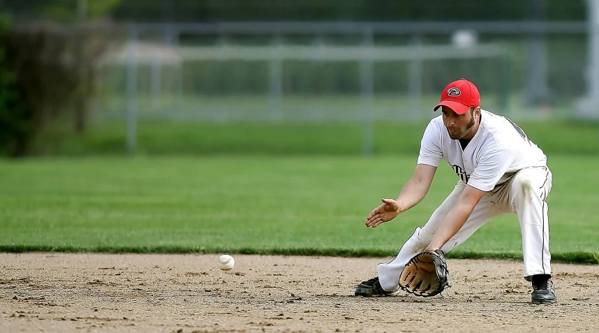 a baseball player getting ready to tag out a baseball