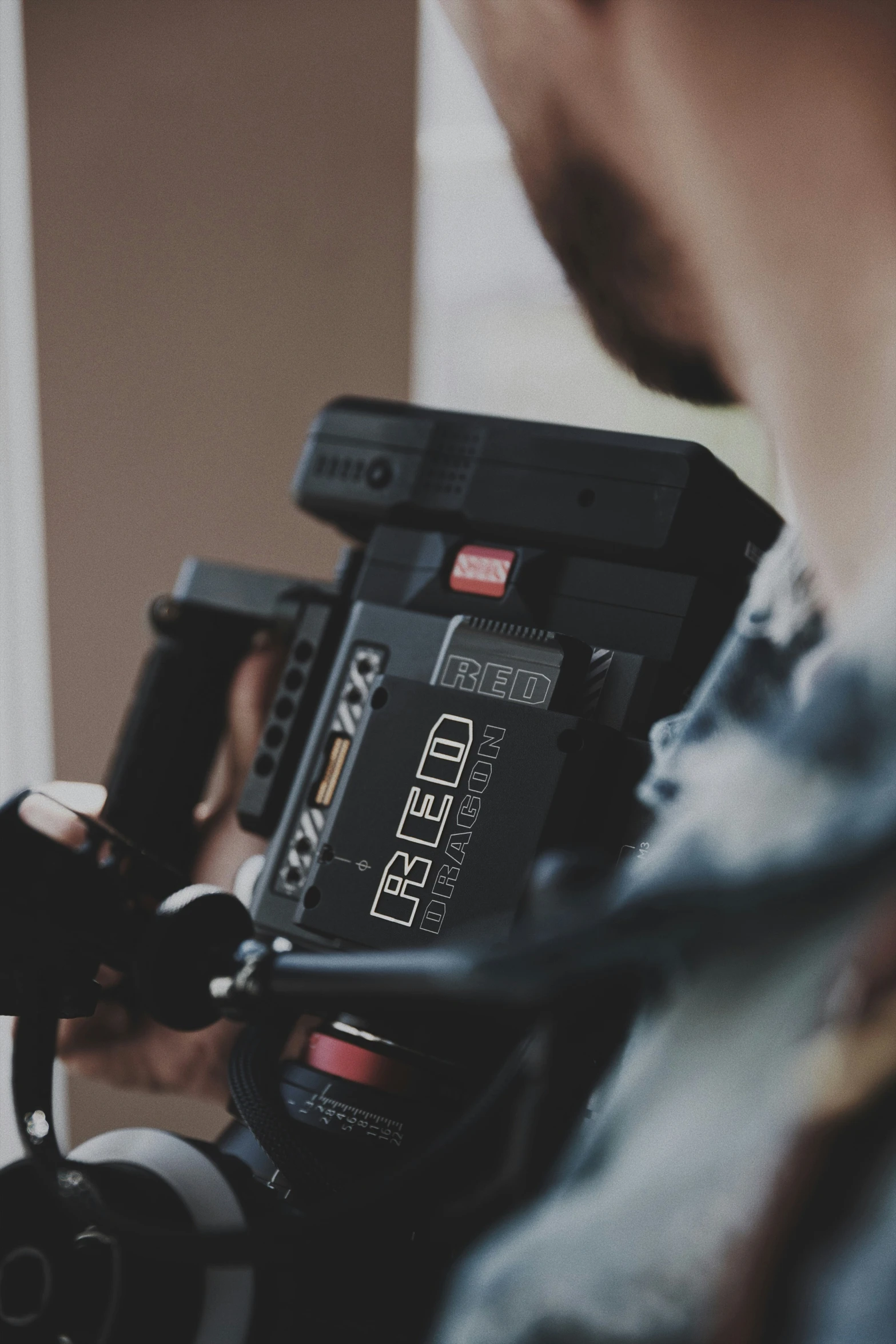 a woman is holding a device with wires in it