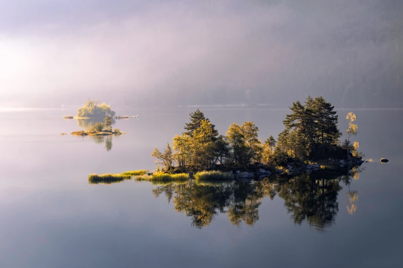 a small island sitting in the middle of a lake