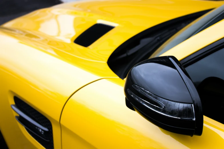 two shiny cars parked near one another