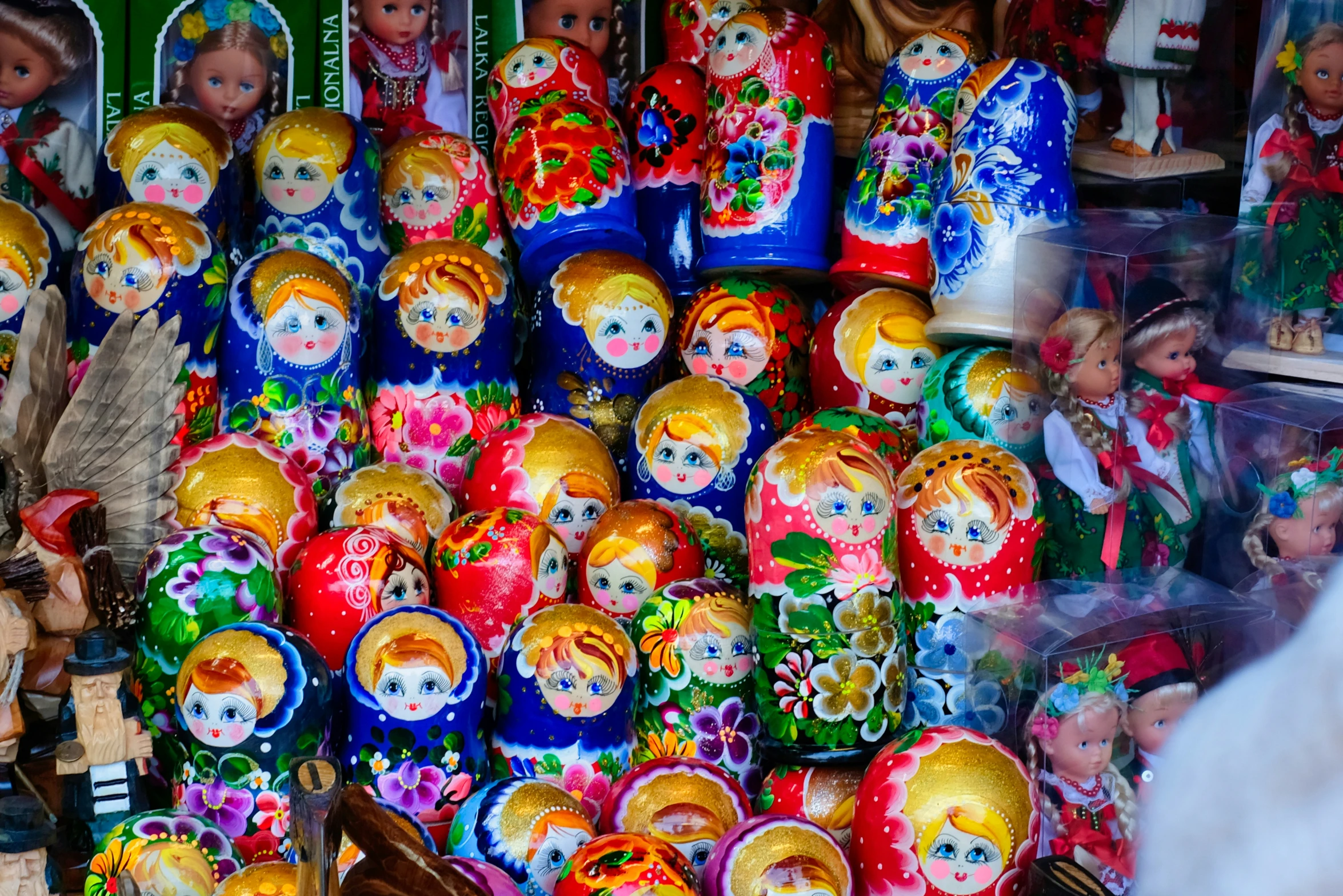 a colorful display with lots of dolls and decorations