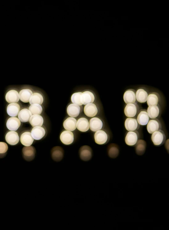 a word that is spelled with light balls in the shape of the letters,'paris '