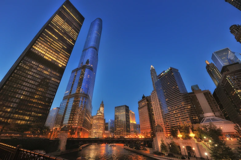 the very large buildings are surrounded by a lot of water