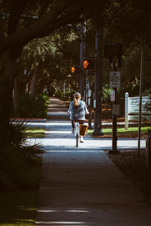 a person riding a skate board on a sidewalk