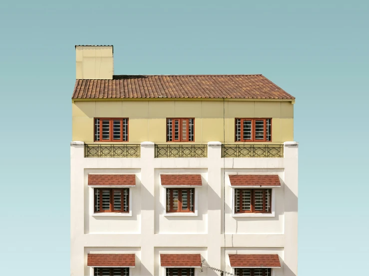 an image of a yellow house with red shutters