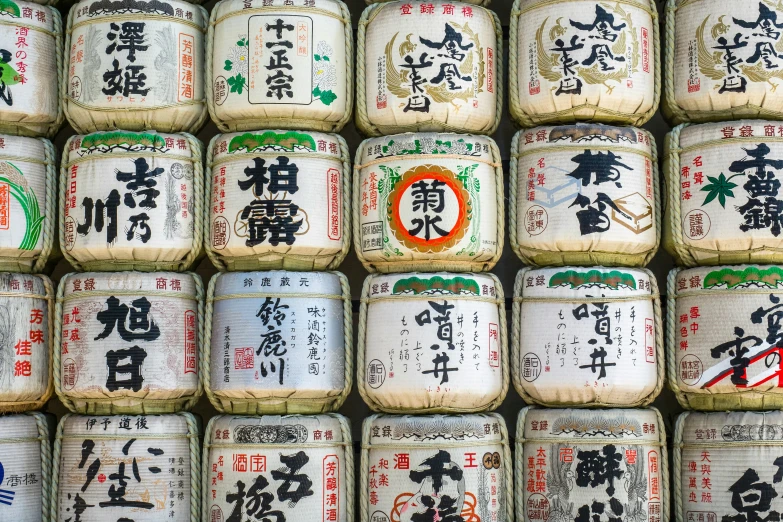 several cans are stacked on each other with asian writing