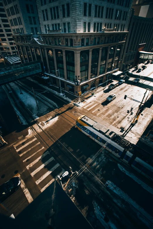 an aerial view of a city street with traffic at twilight