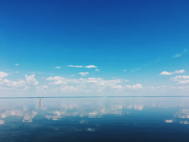 the blue sky reflects the clear water in the ocean