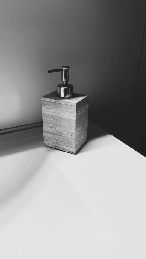 a soap dispenser sitting on a table