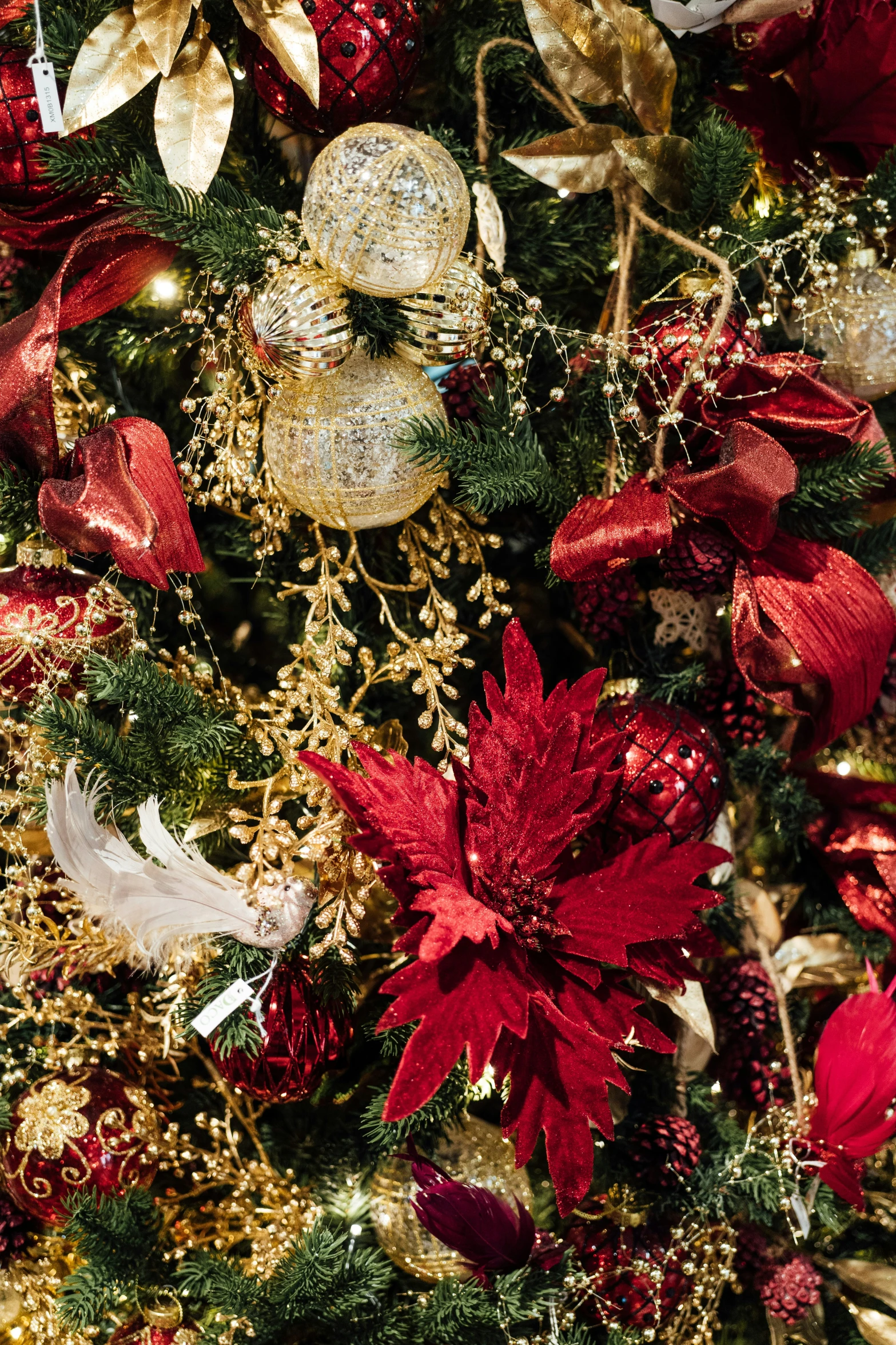 christmas decorations on a christmas tree with red and gold decorations