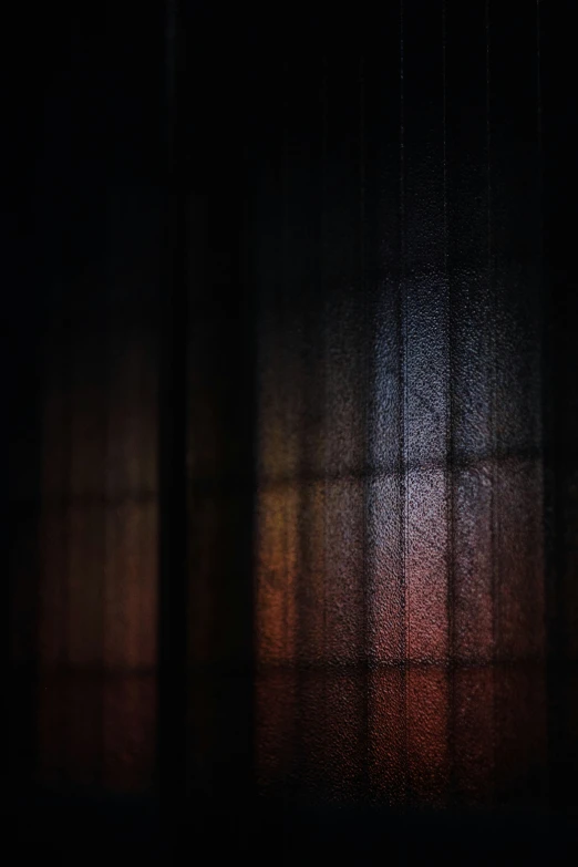 black curtains with lights shining in the background