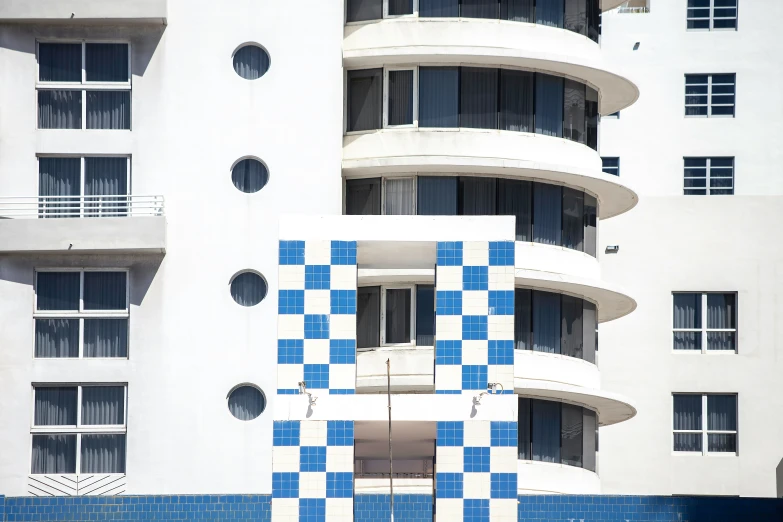 an architectural building painted in different colors with a checkered tile pattern
