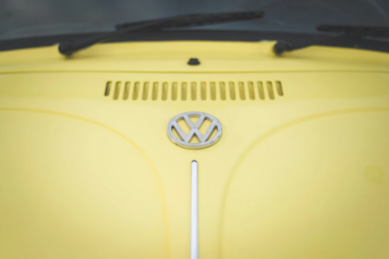 a volkswagen emblem is pictured on the front of a car