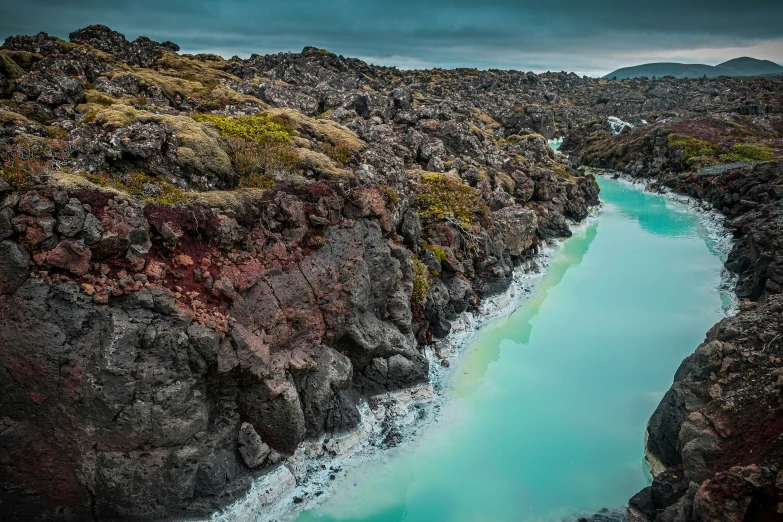 this is a landscape of a large body of water surrounded by rocks