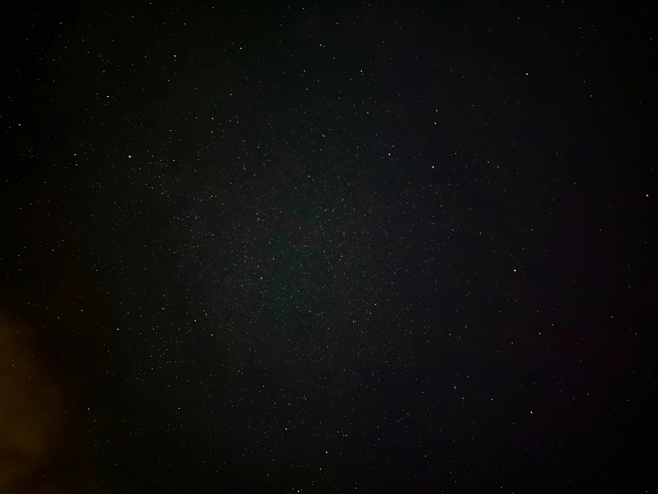 a large dark sky with lots of stars in it
