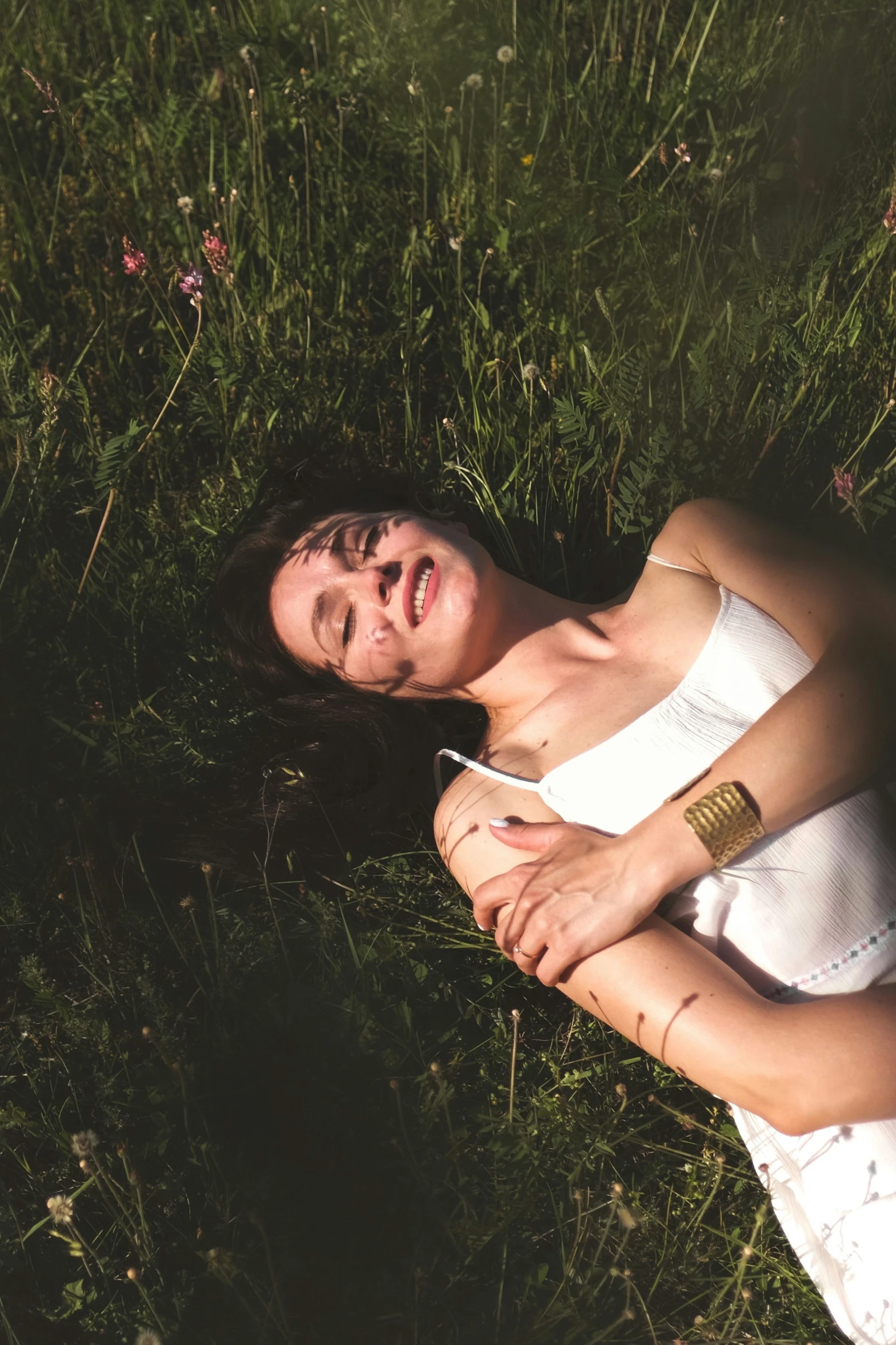 an image of a girl laying on the ground