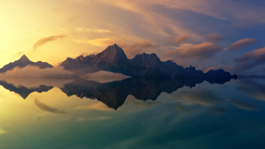 the mountains reflect on water with reflection