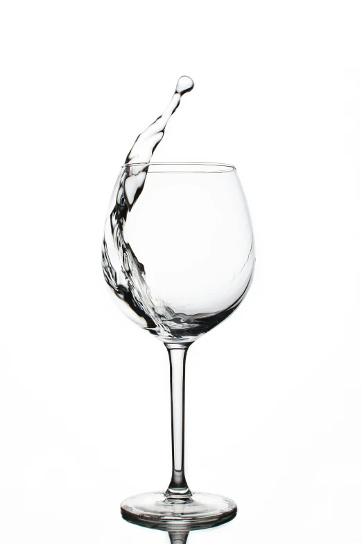 water pouring in to a wine glass