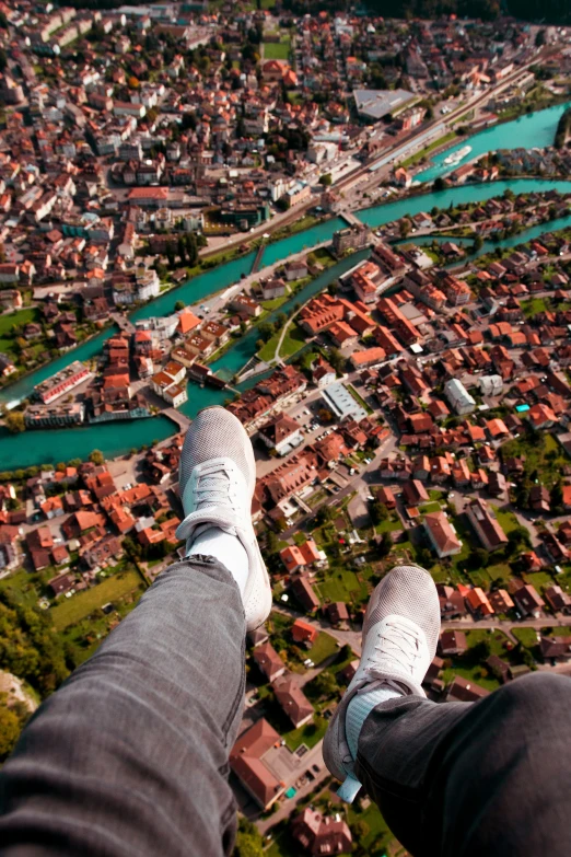 two feet up in the air above a city
