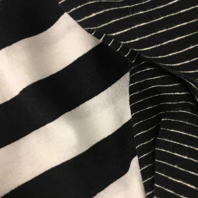 the striped fabric has been placed on the black shirt
