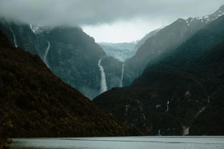 mountains with water falling down from them