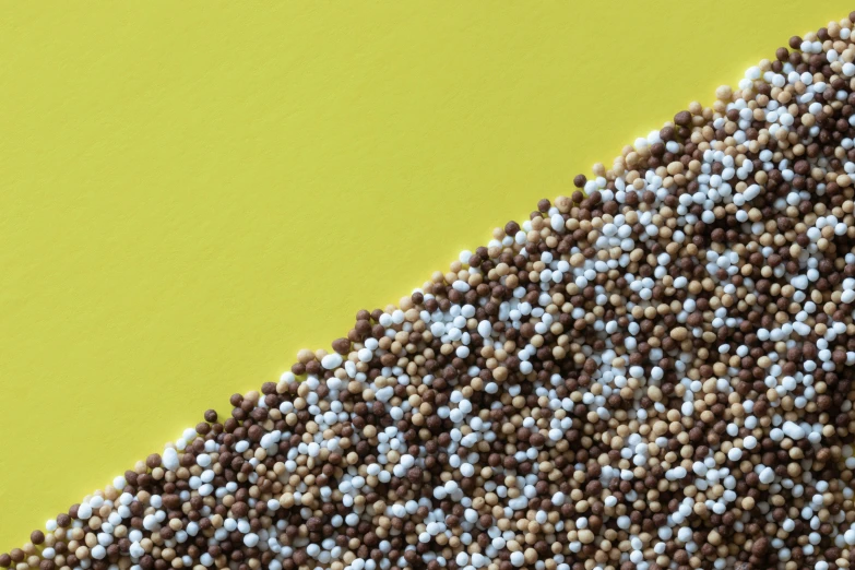 the grain is spread across a yellow background