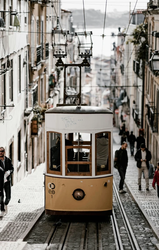 the trolley on the street has stopped to load people