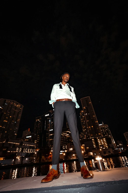 a man in a suit and tie is standing outside