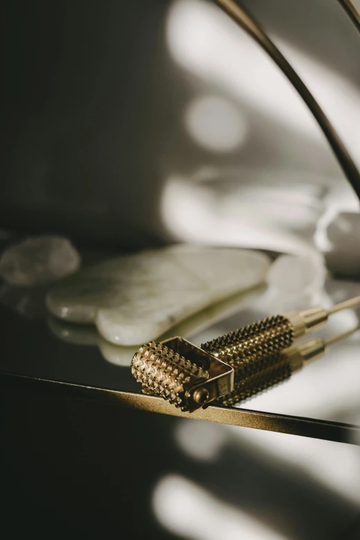 there are two brushes on top of a glass table