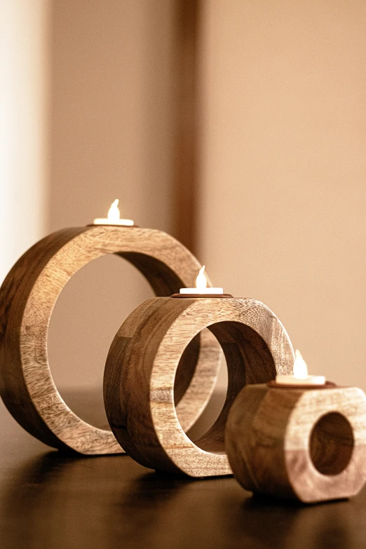 a small pair of wood rings and candles