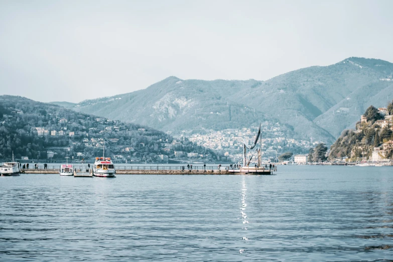 a group of boats traveling down a body of water