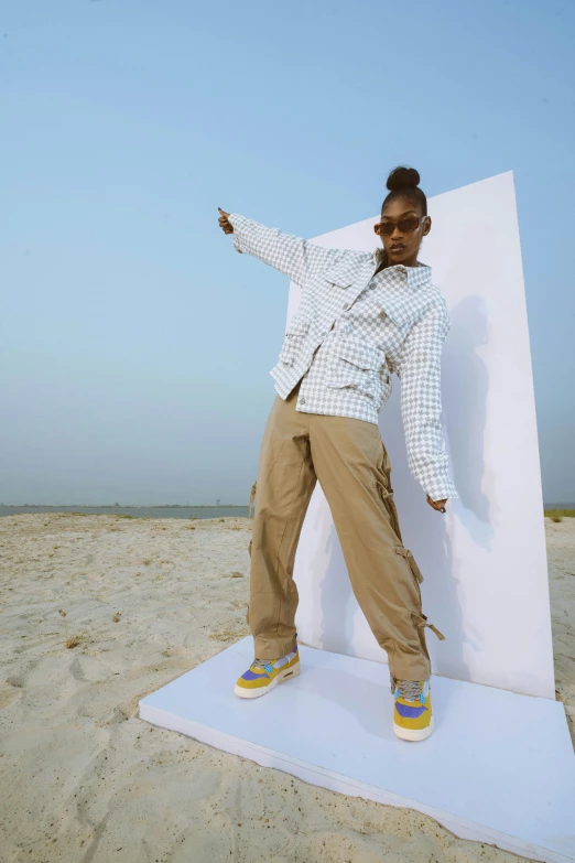 a woman standing on top of a white surfboard