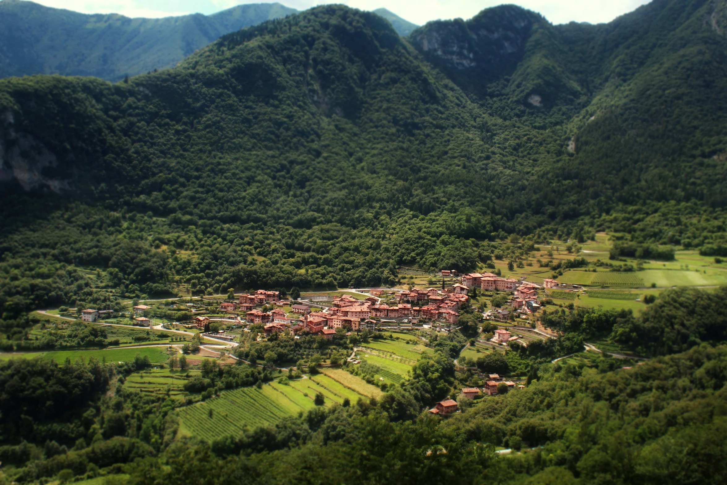 an aerial view of a green mountainous region