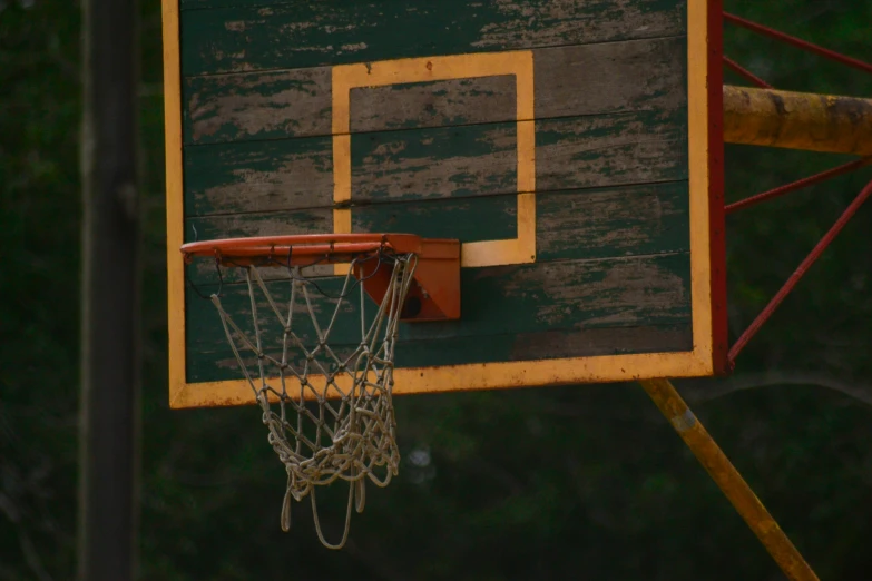 a basketball going through a hoop at a park