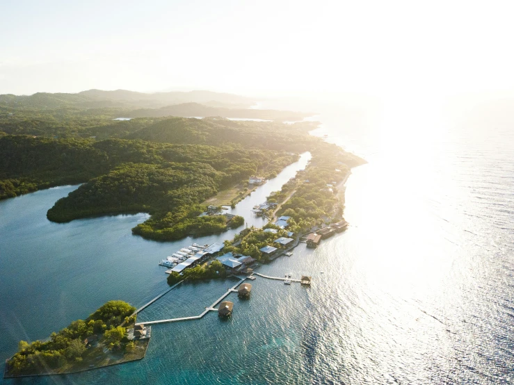 a tropical island resort sits on an idyllic sea