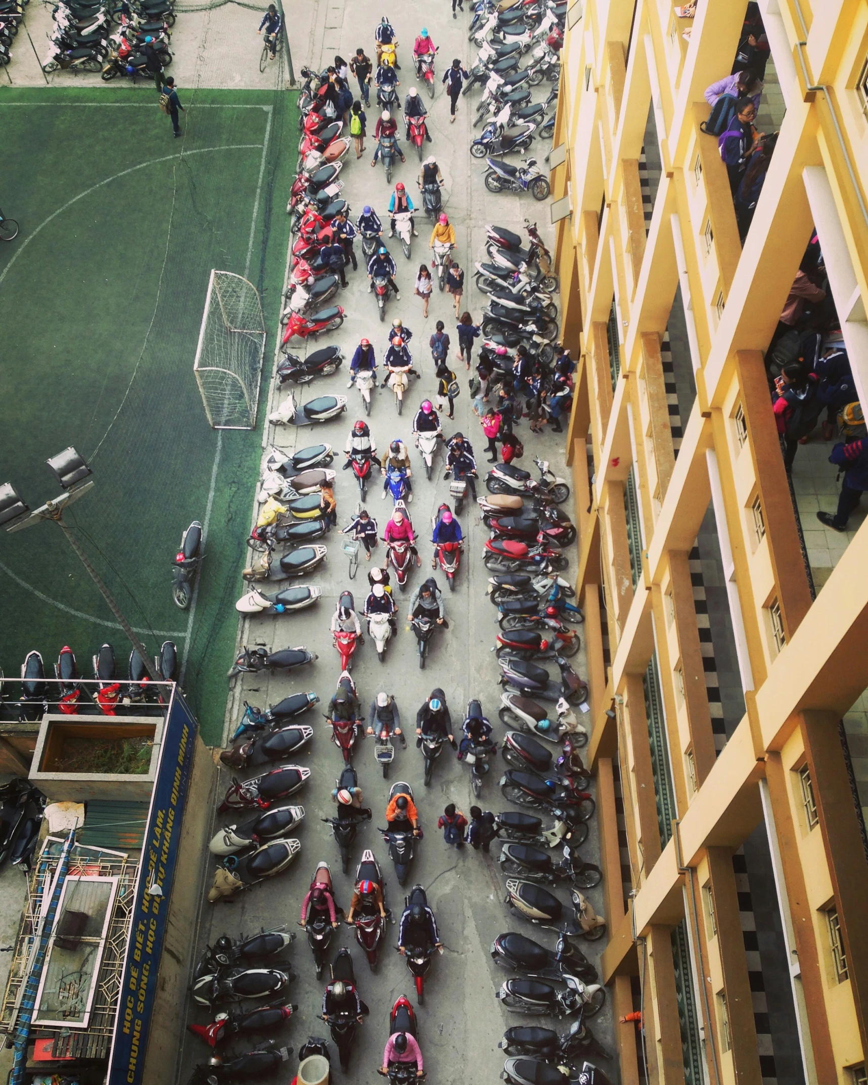 there is a long street full of parked motorcycles