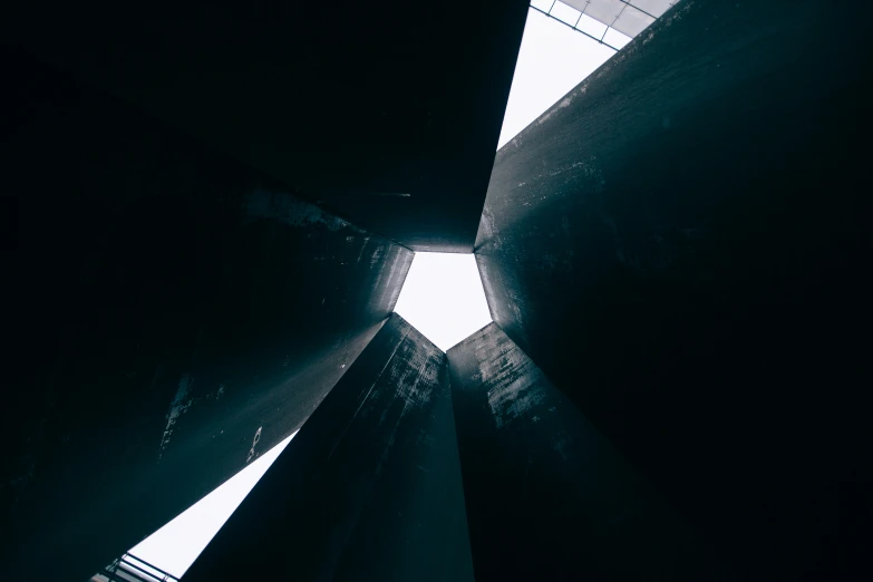 an inverted view of a clock tower from below